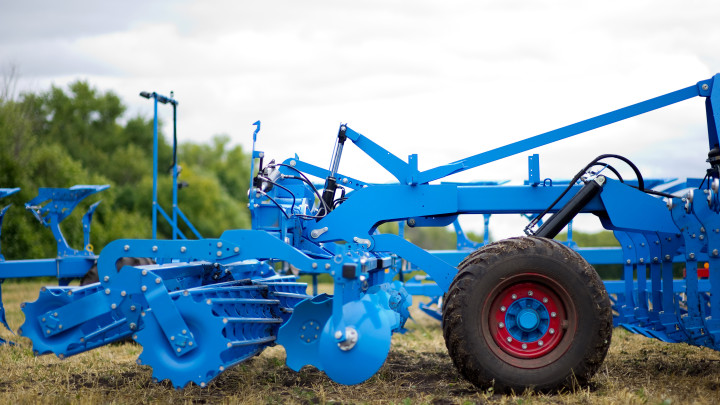 agricultural machinery in blue, fragment with a wheel